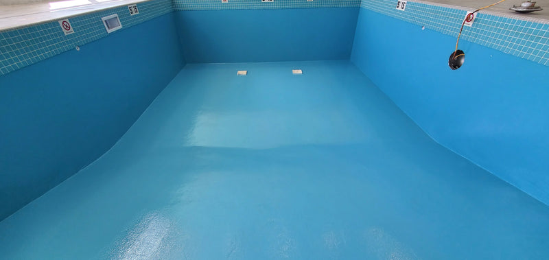 Blue pool interior with tiled walls and floor