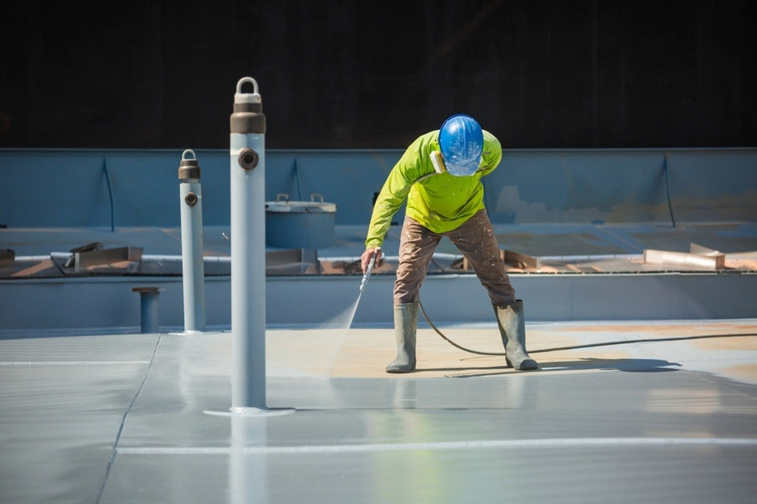 Contractor Spraying Roof with Waterproof Paint | Contractor Application